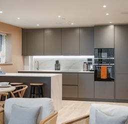A kitchen with cabinets, sink and countertop at tbc in St. Ives
