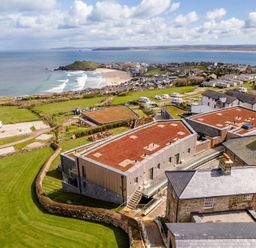 A coastal view with beach and houses at tbc in St. Ives