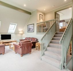 A living room with a sofa and coffee table at The Derwent Spa (Pet) in Slaley