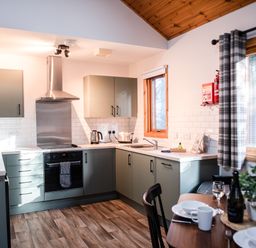 A kitchen with cabinets and a stove at Sidlaw in Fowlis near Dundee