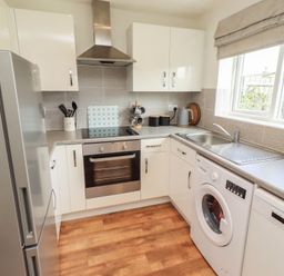 A kitchen with appliances and countertops at 26 Field Court 