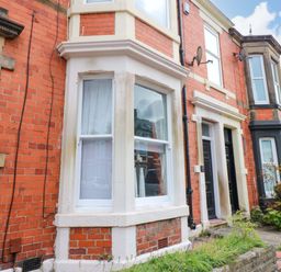 A front exterior view of a house with window and door at 17 Fairfield Road 