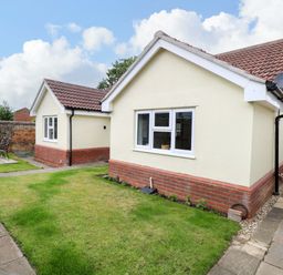 A house with garden and patio area at The Mill House Gardens