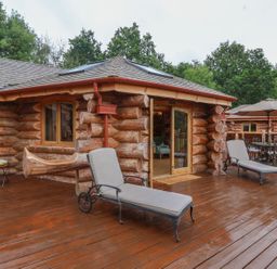 A deck area with lounge chairs and a table at Copper Suite in Chulmleigh