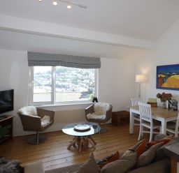 A living room with a window and furniture at Dart Views in Dartmouth