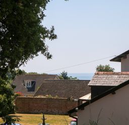 A view of the sea and houses at Gorway Cottage Teignmouth