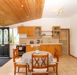 A kitchen with a table and chairs The Headmasters Quarters Chudleigh