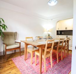 A dining room with a wooden table and chairs at Hafanedd in Betws-y-Coed