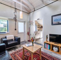 A living room with a sofa and coffee table at Little Linney Sleeps 2 Garden Parking Wifi in Hartland