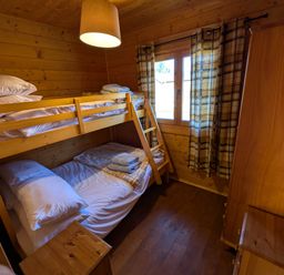 A bedroom with bunk bed and double bed at Pet Friendly - Lodge at Riverview Holiday Park, Mangerton near Newcastleton