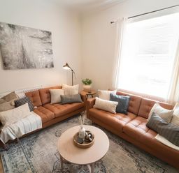 A living room with two sofas and a coffee table at Foundry Farm Apartment 