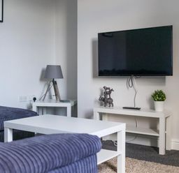 A living room with a television and decorative items at Lily Apartment - Sleeps 3 - Pet friendly - Parking Bedlington
