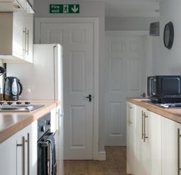 A kitchen with appliances and countertops at Lily Apartment - Sleeps 3 - Pet friendly - Parking Bedlington