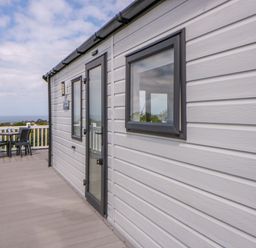 An outdoor area with a table and chairs at The Dorchester at Bay View New Quay