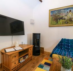 A living room with a television and a coffee table at Ty Loti