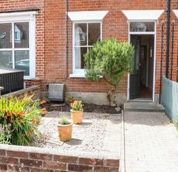 A front yard with plants and a pathway at 19 Covert Road Reydon