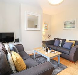 A living room with a couch and coffee table at 19 Covert Road in Reydon