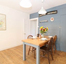 A dining room with a table and chairs at 19 Covert Road in Reydon
