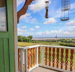 A balcony view overlooking the countryside at Hay Loft at Ebenezer Chapel in Milwr