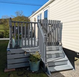 A staircase leading to a deck at Clarach Bay Holiday Village W18 Aberystwyth