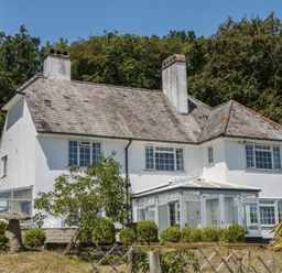 A house with windows and a garden at The White House in Okehampton