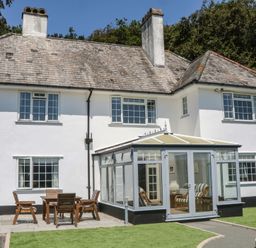 A house with a garden and outdoor seating at The White House Okehampton