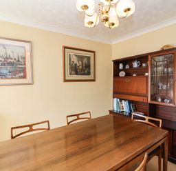 A dining room with a table and chairs at Number 10, Broadway