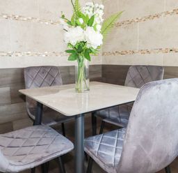 A dining room with a table and chairs at Two Bed Apartment No.4 Newquay