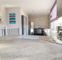 A kitchen with a table and chairs at Two Bed Apartment No.4 Newquay