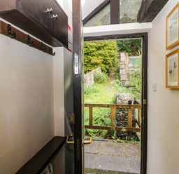 An entrance with a door and coat hooks at Dunmail Raise, Grasmere Lodge