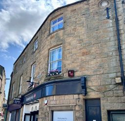 A building with windows and signage at Downton I Alnwick