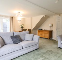 A living room with sofas and a dining table at Frome View in Wool