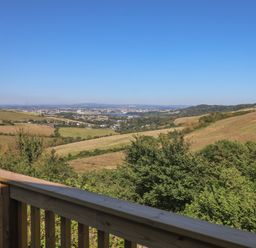 A scenic view of hills and a city in the distance at Lodge 19 Millbrook