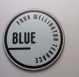A sign indicating Four Wellington Terrace and Blue