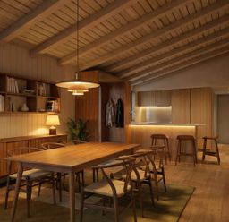 A dining room with a wooden table and chairs at Arbora 3.0 Spa (Pet) Malvern