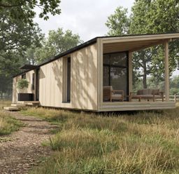 A wooden house with deck and chairs at Arbora 1.0 Spa (Pet) in Malvern