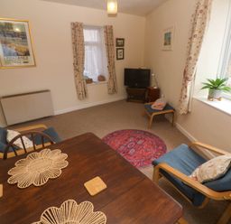 A living room with a table and chairs at Chyancrowse in Gulval
