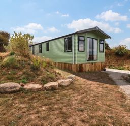 A green house with pathway and plants at Roslenn St Agnes