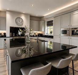 A kitchen with an island and appliances at Chowdene Lodge Estate 