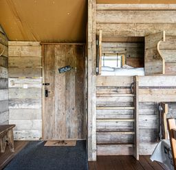 A bedroom with a bunk bed and wooden furniture at Luxury Safari Lodge Sleeps 4/6 Deer Park Dogs Ok Zeal Monachorum near Bow