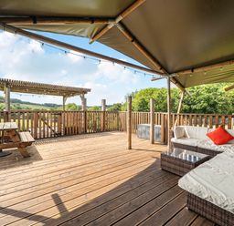 An outdoor area with seating and a table at Luxury Safari Lodge Sleeps 4/6 Deer Park Dogs Ok Zeal Monachorum near Bow