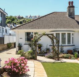 A house with garden and flowers at 3 Heath Park Brixham