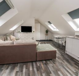 A living room with a sofa and television at Fields view in Bridlington