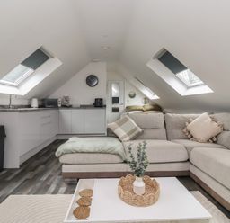A living room with a sofa and coffee table at Fields view in Bridlington