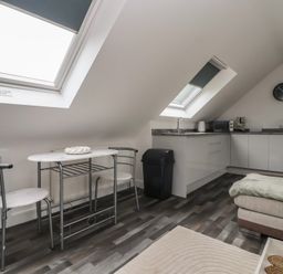 A kitchen area with dining table and chairs at Fields view Bridlington