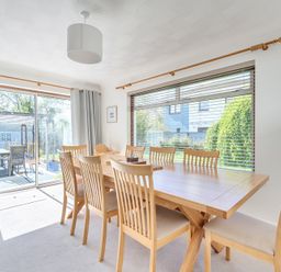 A dining room with a large table and several chairs at Sleeps 9 KingBeds Family Friendly Pityme near Penmayne