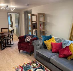 A living room with a sofa and dining area at Luxury 2 bedroom Lodge in rural lincolnshire, Kirton