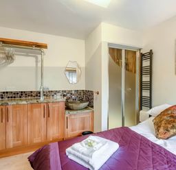 A bedroom with a bed and a sink at Luxury 2 bedroom Lodge in rural lincolnshire Kirton