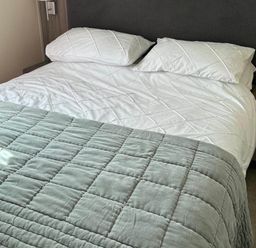 A bedroom with a bed and pillows at Caravan in Holcot Sleeps 6 Max 6 people Max 4 adults per booking Pet Friendly Holcot near Moulton