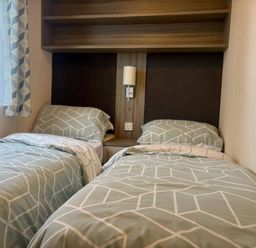 A bedroom with two single beds at Caravan in Holcot Sleeps 6 Max 6 people Max 4 adults per booking Pet Friendly Holcot near Moulton